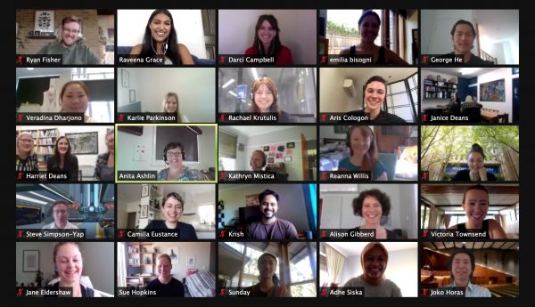 Screenshot of a grid of 25 people on a Zoom call from their home offices.