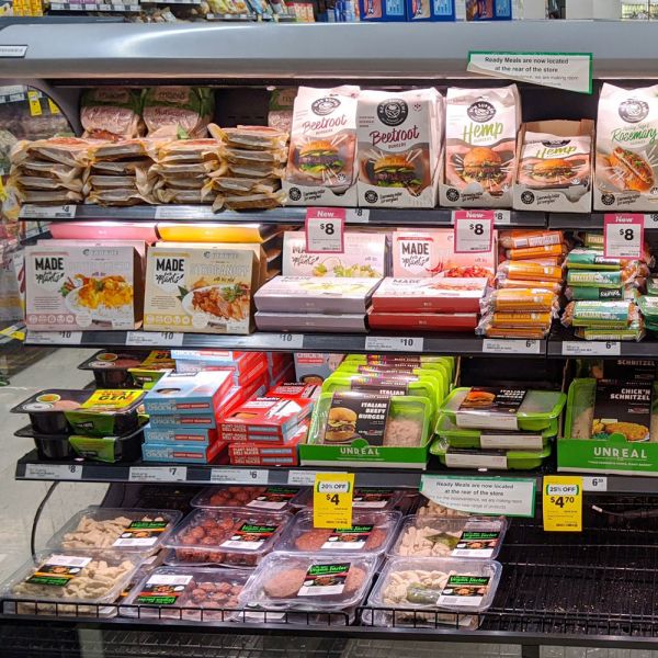 Supermarket shelf display of plant-based alternatives to meat products